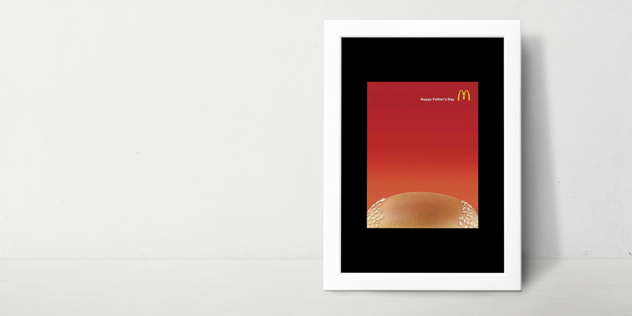 MekDonalds marketinška reklama za dan očeva gde je deo gorenjeg dela zemičke bez susama.